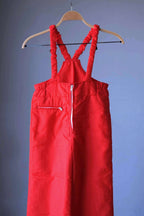 Front view of the red ski bib from the Warmia vintage ski suit.