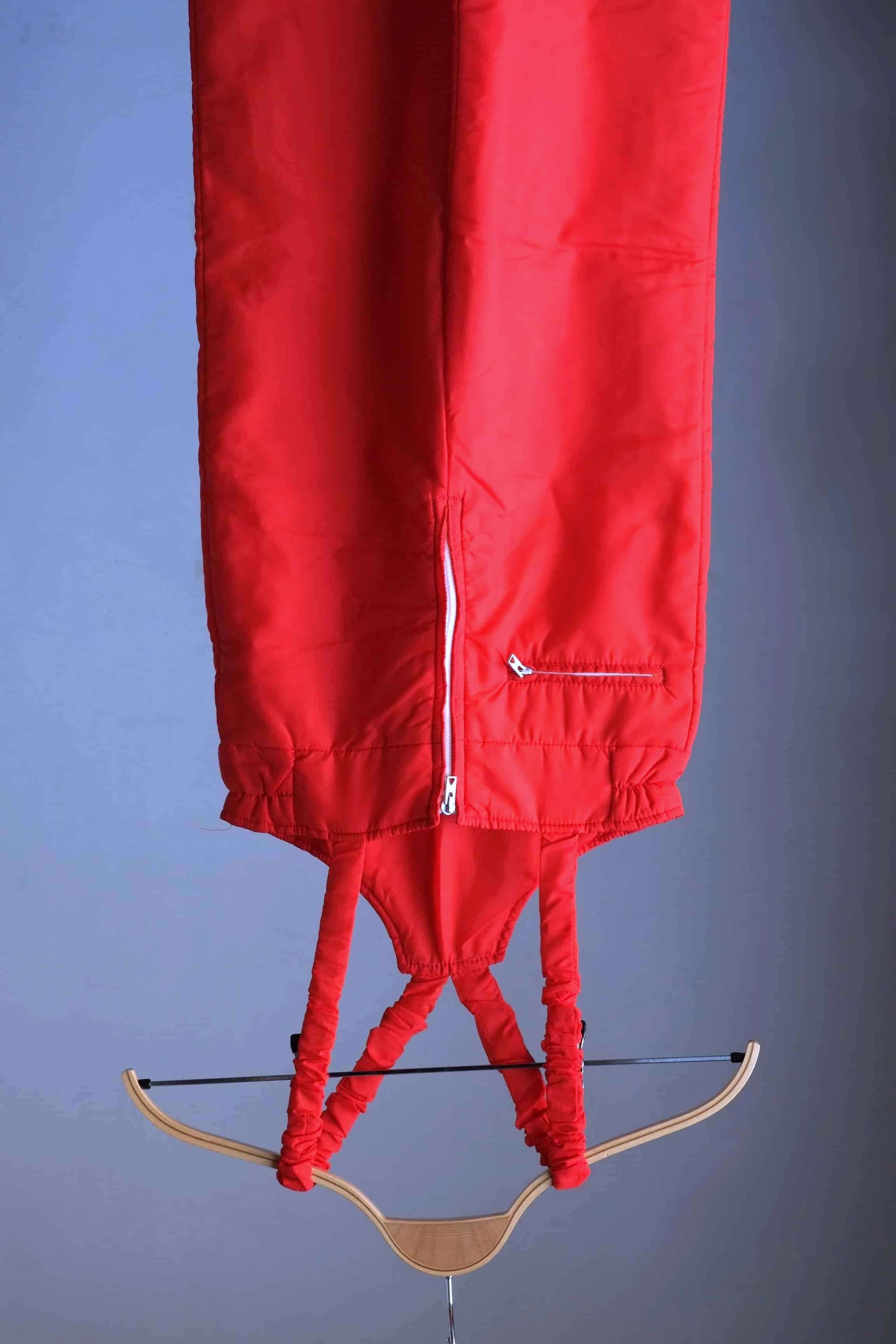 Front view of the red ski bib from the Warmia vintage ski suit.
