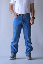 Front view of Wrangler medium-wash jeans with a straight-cut leg and crease detail.