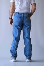 Rear view of Wrangler jeans showing the signature "W" pocket stitching and logo patch.