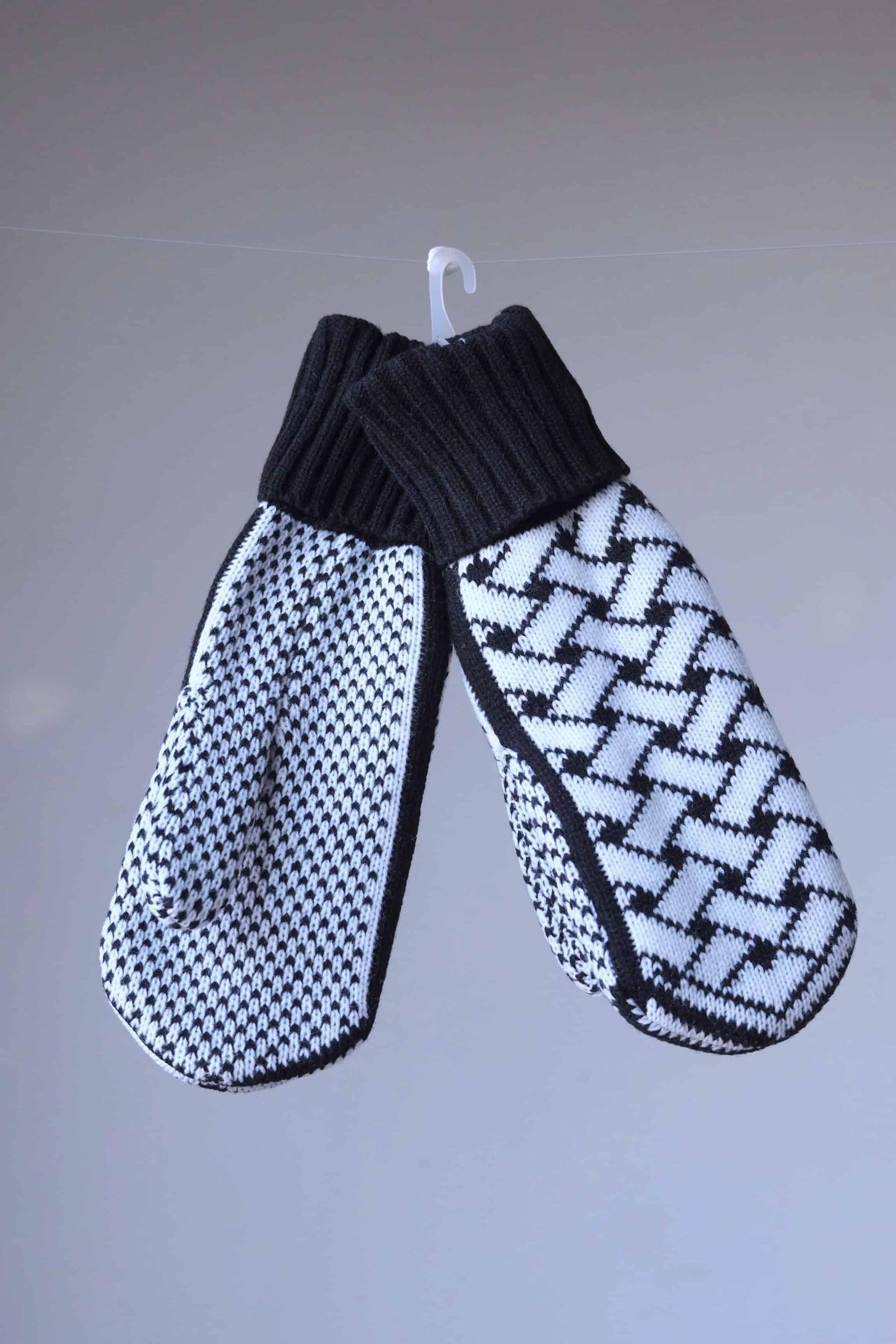 White and black wool mittens