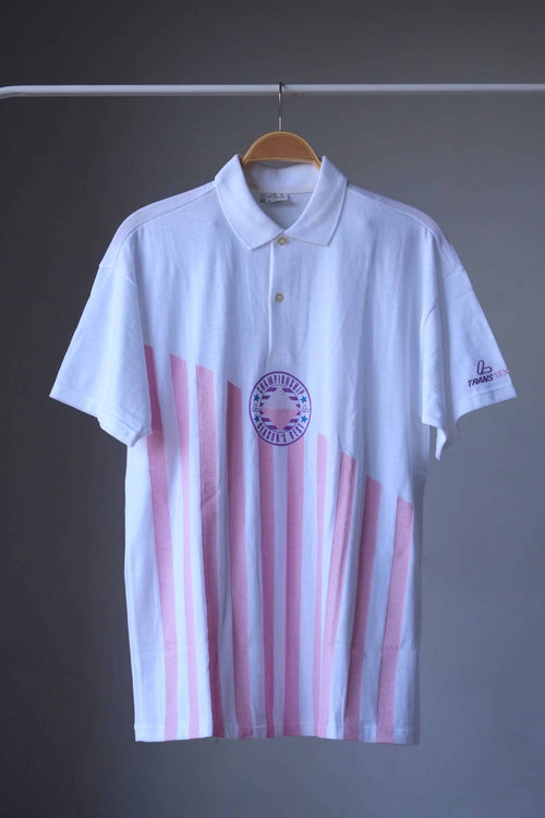 Löffler 90s men’s tennis polo in white with pink vertical stripes and a purple Championship Season’s Best badge, front view