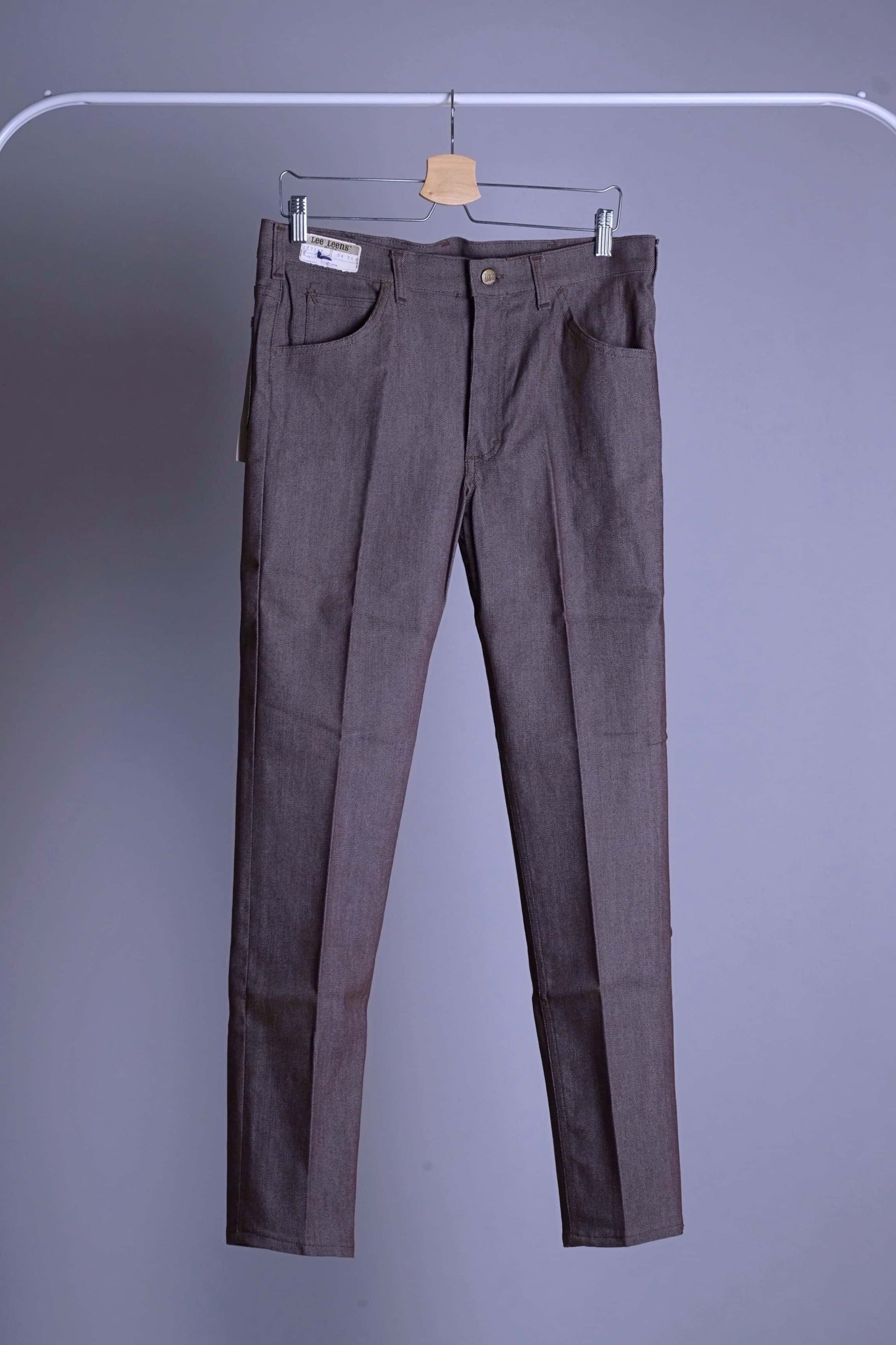 Full front shot of the dark heather brown vintage Lee Leens stretch trousers, showcasing the straight/slim leg fit.