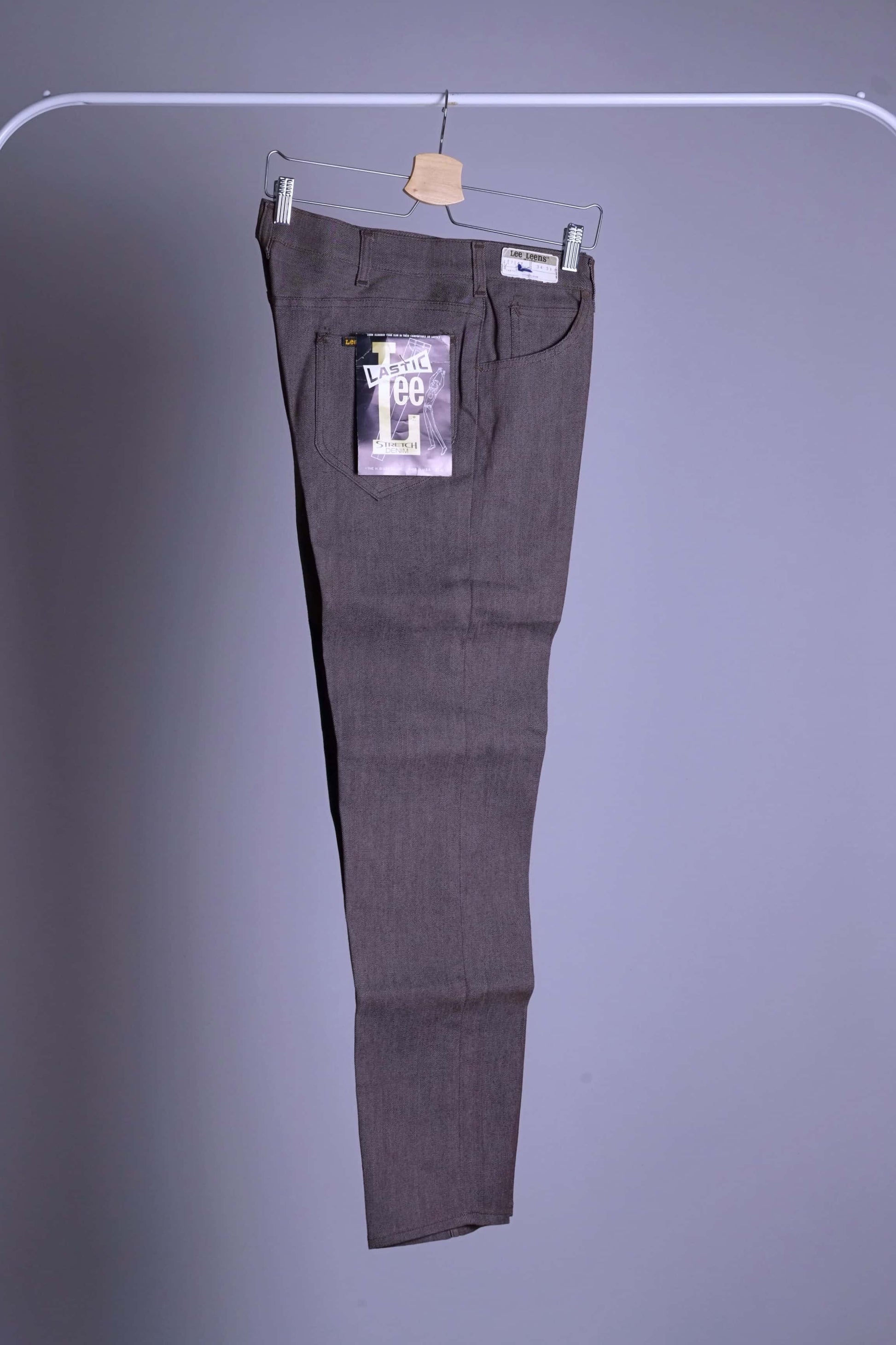 Vintage 1970s Lee Leens trousers in heathered brown stretch fabric, displayed flat with 'Lee Leens' pocket tag.