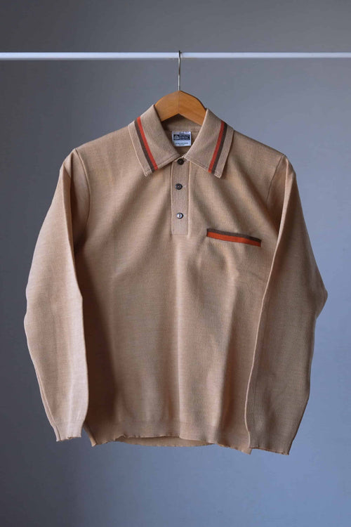 Full front view of a vintage beige long-sleeve wool knit polo sweater on a wooden hanger against a gray background.