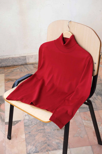 Rollneck 70's Sweater burgundy on chair