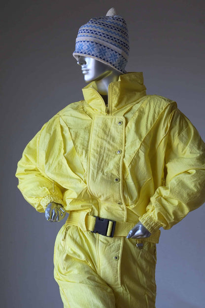 CAMPRI Vintage 90's Ski Suit in yellow displayed on mannequin