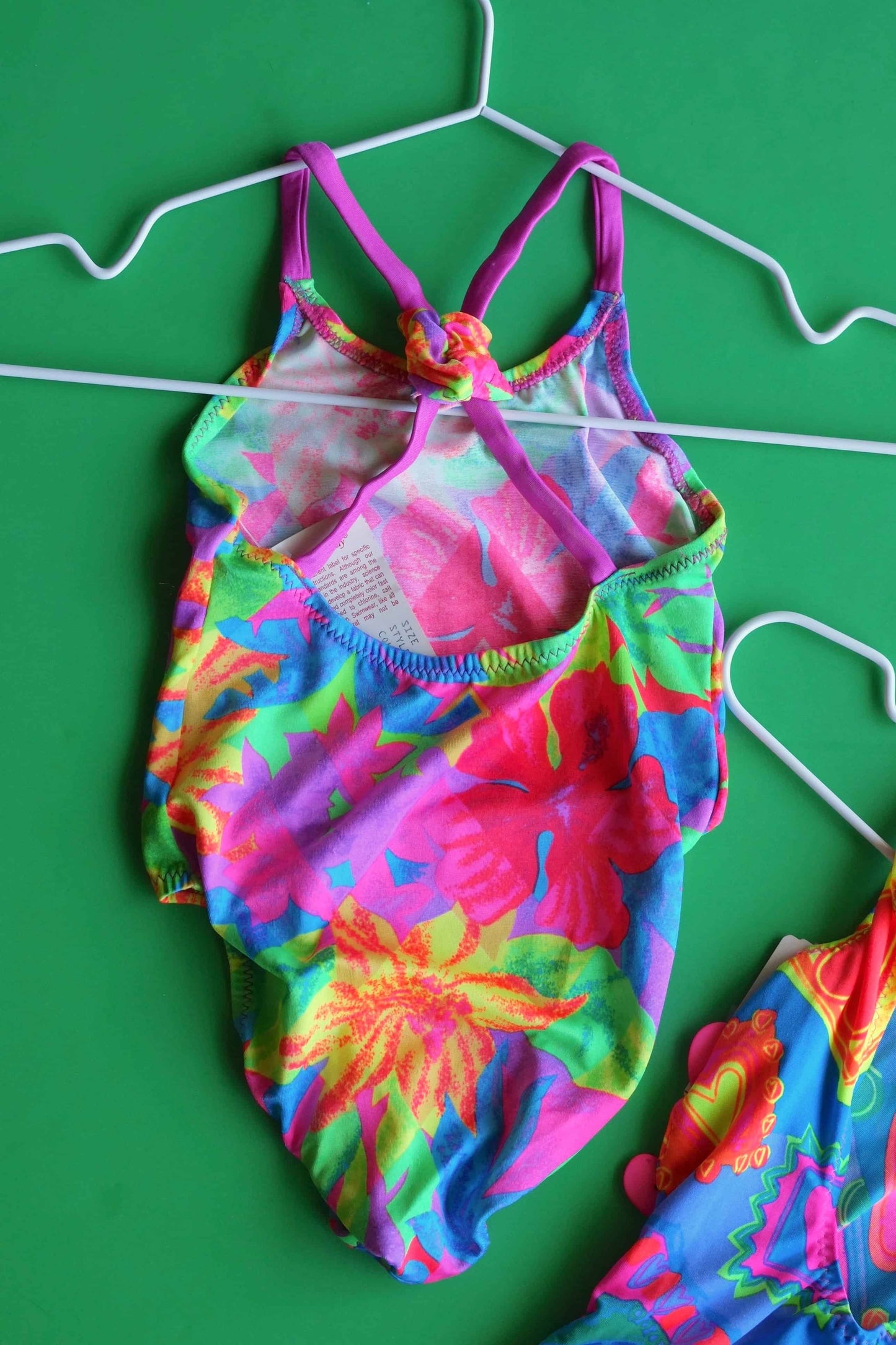 90's Kids Neon Flower One-piece backside on green background