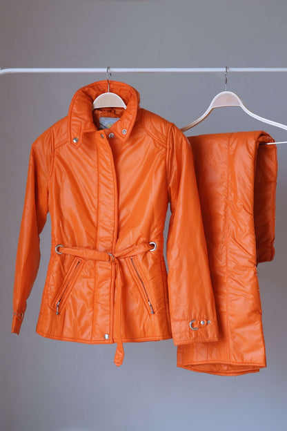 Orange Mossant Vintage 70s women's 2-piece ski suit on hanger