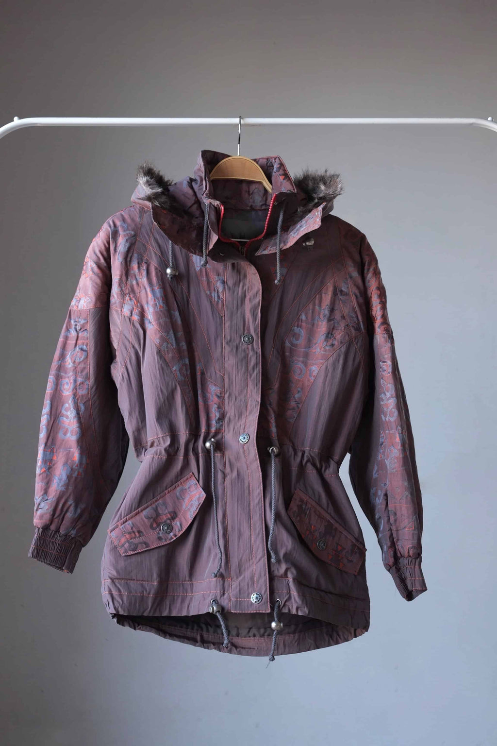 Vintage 90's Women's Ski Jacket in maroon with fur lined hoodie on hanger